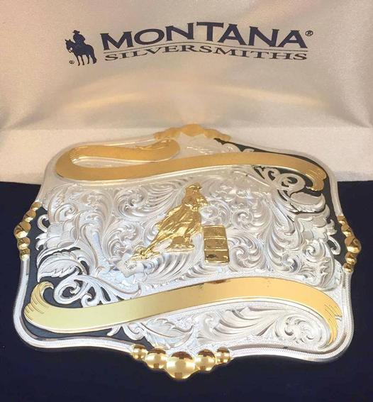 This large sterling silver and 22 carat gold finished buckle has three lines of ribbon for personalization. High domed beads accent the center of the sides while a bright silver finish graces the inner detailing of flowing plumes and floral accents and le